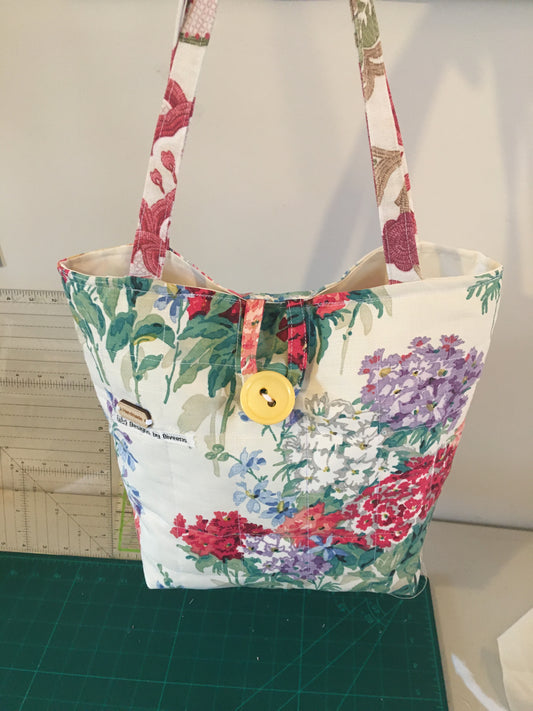 Floral tote handbag button closure
